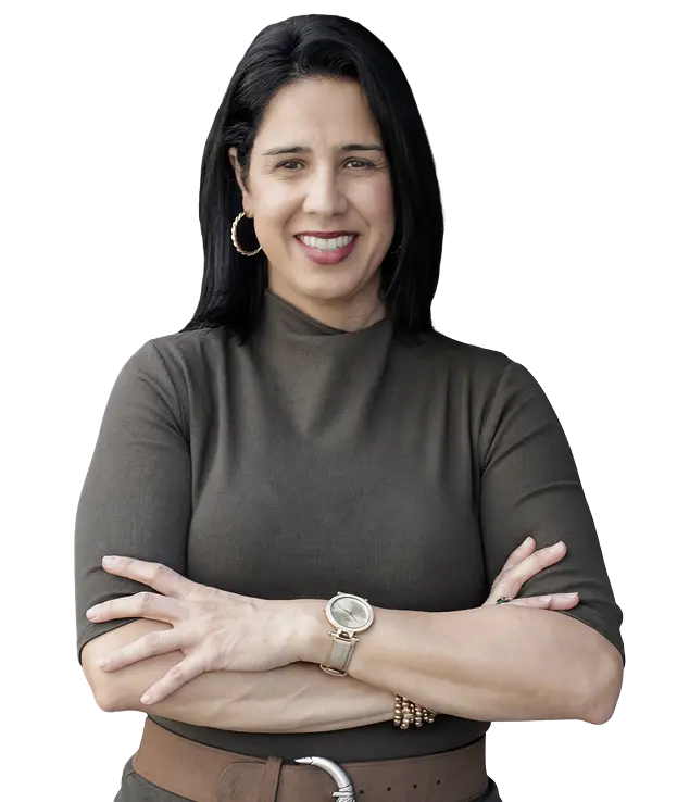 Confident woman smiling with arms crossed